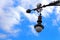 Old street lamp over blue sky