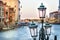 Old street lantern in Venice with the Grand Canal in the background