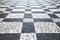 Old street road paved surface stone pavement walkway texture pattern Chess board.