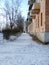 Old street with a sidewalk in Russia. Street with apartment buildings. A small town in the province of Russia.