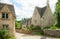 Old street with traditional cottages in Bibury.