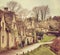 Old street with traditional cottages in Bibury.