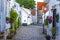 Old street with white wooden houses with tiled roofs