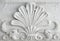 Old stucco molding. Vintage decorative element on white wall texture