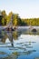 Old Stumps Dot the Surface Of This Small Canadian Lake