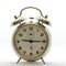 Old style alarm clock, metal, it`s quarter past nine.