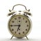 Old style alarm clock, metal, it`s quarter to seven.