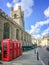 Old style British telephone booths by Great Saint Mary church in the University city of Cambridge UK