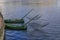 Old style fishing boats with raised fishing nets on Lilla Vartan strait moored in the city center in Stockholm, Sweden