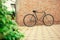 Old style singlespeed bicycle against brick wall