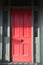 Old style wooden door in red and grey