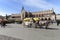 Old-styled horse carriage on main market square next to Cloth Hall