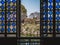 Old-styled stained glass windows and open doorway with a beautiful nature view