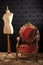 Old styled tailor mannequin and armchair