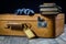 Old stylish suitcase. Old books in a suitcase. Suitcase on a wooden table.