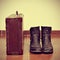 Old suitcase and worn boots