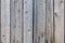 Old sun-bleached wooden fence. Texture background or backdrop