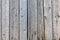 Old sun-bleached wooden fence. Texture background or backdrop