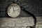 Old swiss pocket watch on the wooden boards