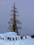 Old tallship or sailboat with adelie penguin