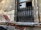 Old Tbilisi architecture, yard, windows in summer day. Old brick wall