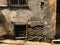 Old Tbilisi architecture, yard, windows in summer day. Old brick wall