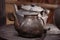 Old teapot and kettle in a kyrgyz yurt kitchen