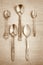 Old teaspoons on vintage background. Monochromatic photo