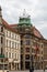 Old tenement building with Polish flags and european union flags on top