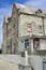 Old tenement on edge of beach