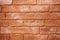 An old terracotta stone wall background texture in brown tones