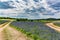 Old Texas Dirt Road in Field of Texas Bluebonnet Wildflowers