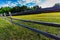 An Old Texas Wooden Rail Fence with a Field Peppered with Texas