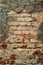 Old textured brick wall with peeling cement plaster. creative vertical background