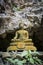 Old Thai style budda immage in front of the cave