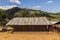 Old Thai style wooden house with rusty zinc roof