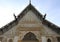 Old Thai temple gable designed - by beautiful old builders and lettered - indicating the year - built in the countryside of