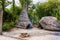 Old thatch cottage with camp fire, concept of early age human settlement