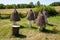 Old thatched beehives structure folk architecture on rural landscape in Pyrohiv, Ukraine