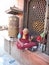 An old Tibetan Buddhist monk called lama counting his prayer beads sitting in the veranda