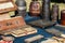 Old Tibetan praying books and milk wooden containers in display