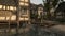 Old timber framed buildings by the shore in a medieval port town 3D rendering