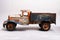 old tin cargo truck toy from the year 1950 faded profile