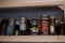 Old tins of food in cupboard in kitchen in derelict house. Harrow UK