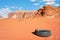 Old tire discarded in Wadi Rum desert, nature pollution concept