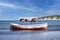 An old tired boat in the middle of the sea.