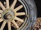 Old tires with metal Wagon wheel spikes in the desert in Arizona in a deserted ghost mining town.