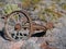 Old tires with metal Wagon wheel spikes in the desert in Arizona in a deserted ghost mining town.