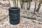 Old tires are stacked one by one on the parking with copy space. A set of four winter or summer wheels. Tire service. Sale of used