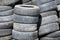 Old tires stacked in a pile, close-up photo